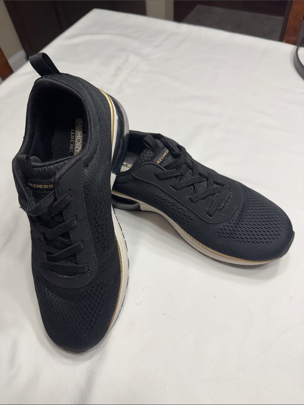 EUC Skechers memory foam slip on black sneakers. Size 8.5 Wide fit.